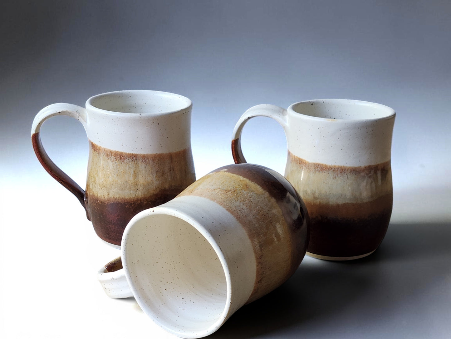 Three Handmade 400 ml stoneware coffee mugs in earthy glaze colours