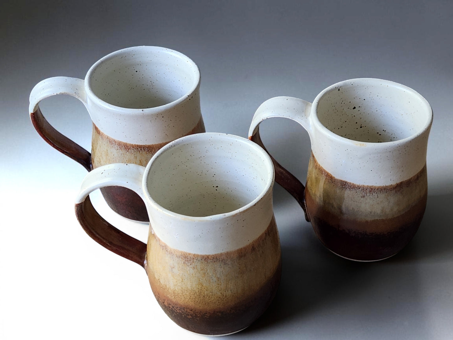 Red-brown cream and oatmeal ceramic mugs handmade in Melbourne