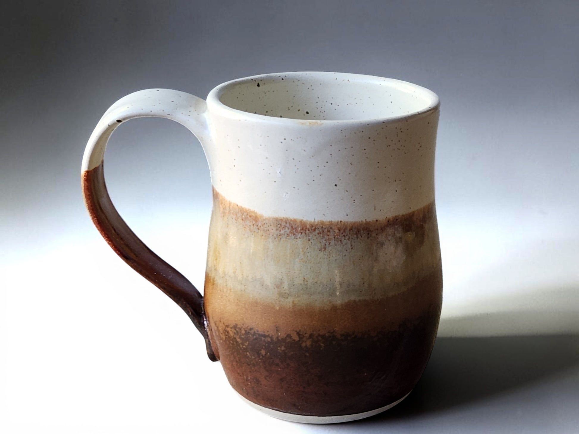 Large ceramic tea mug measuring 11 cm high and 8.5 cm wide