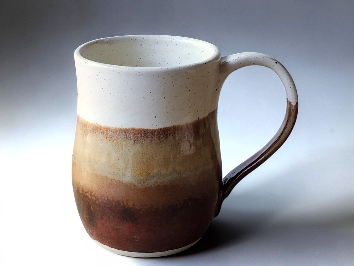 Earthy red-brown coffee mug sold individually