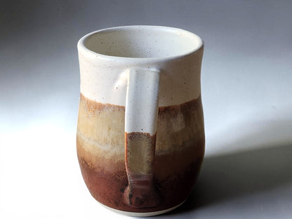 Earthy red-brown coffee mug sold individually