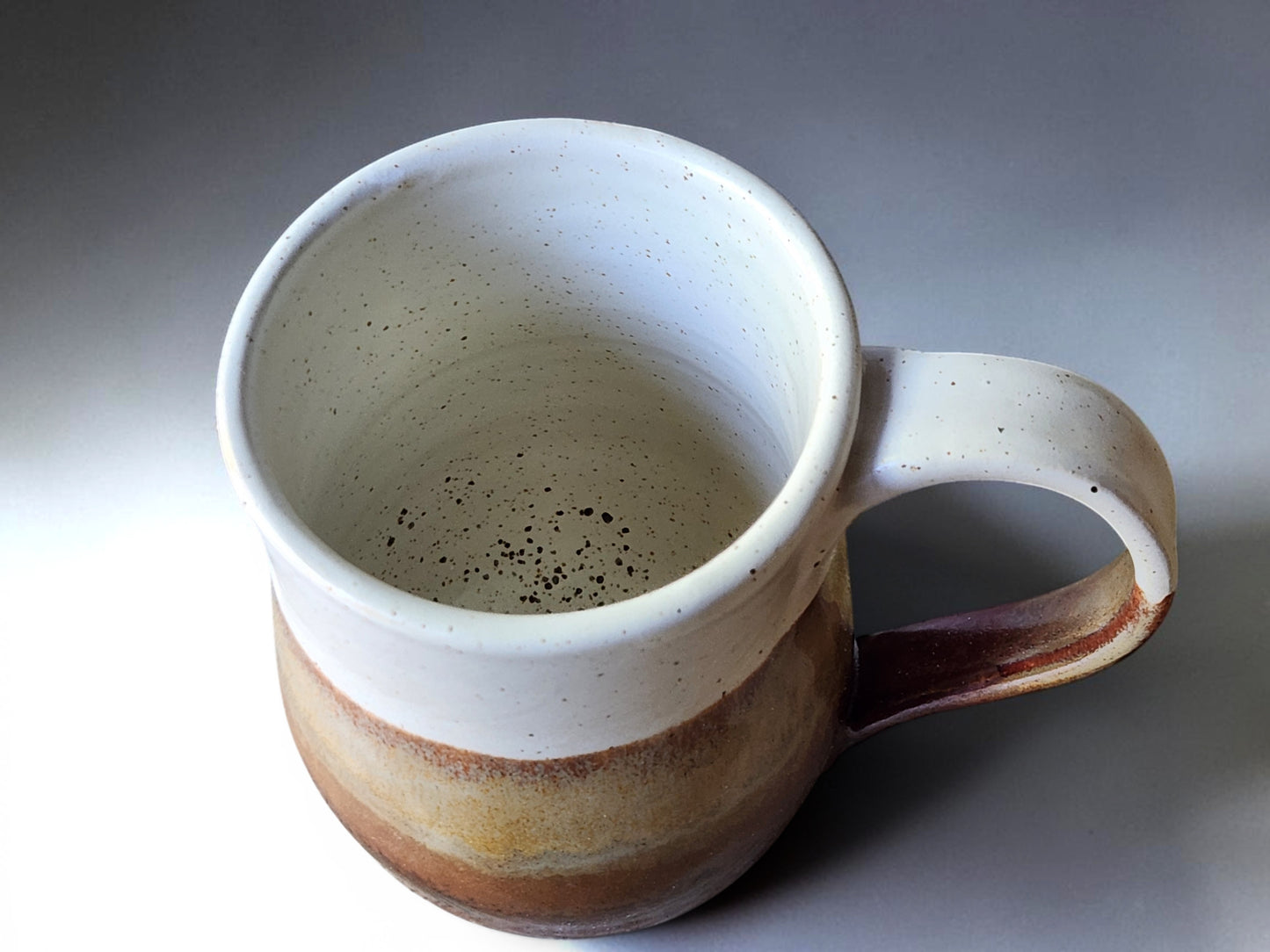 Speckled cream interior of handmade Australian stoneware mug