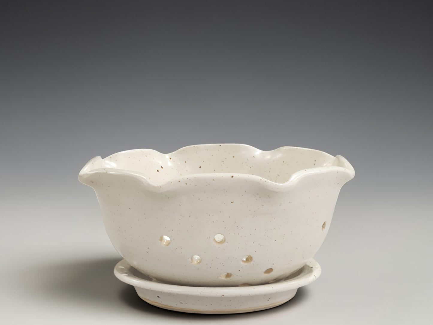 Handmade ceramic berry bowl with matching saucer in speckled cream glaze, crafted by Buxton Pottery in Melbourne Australia