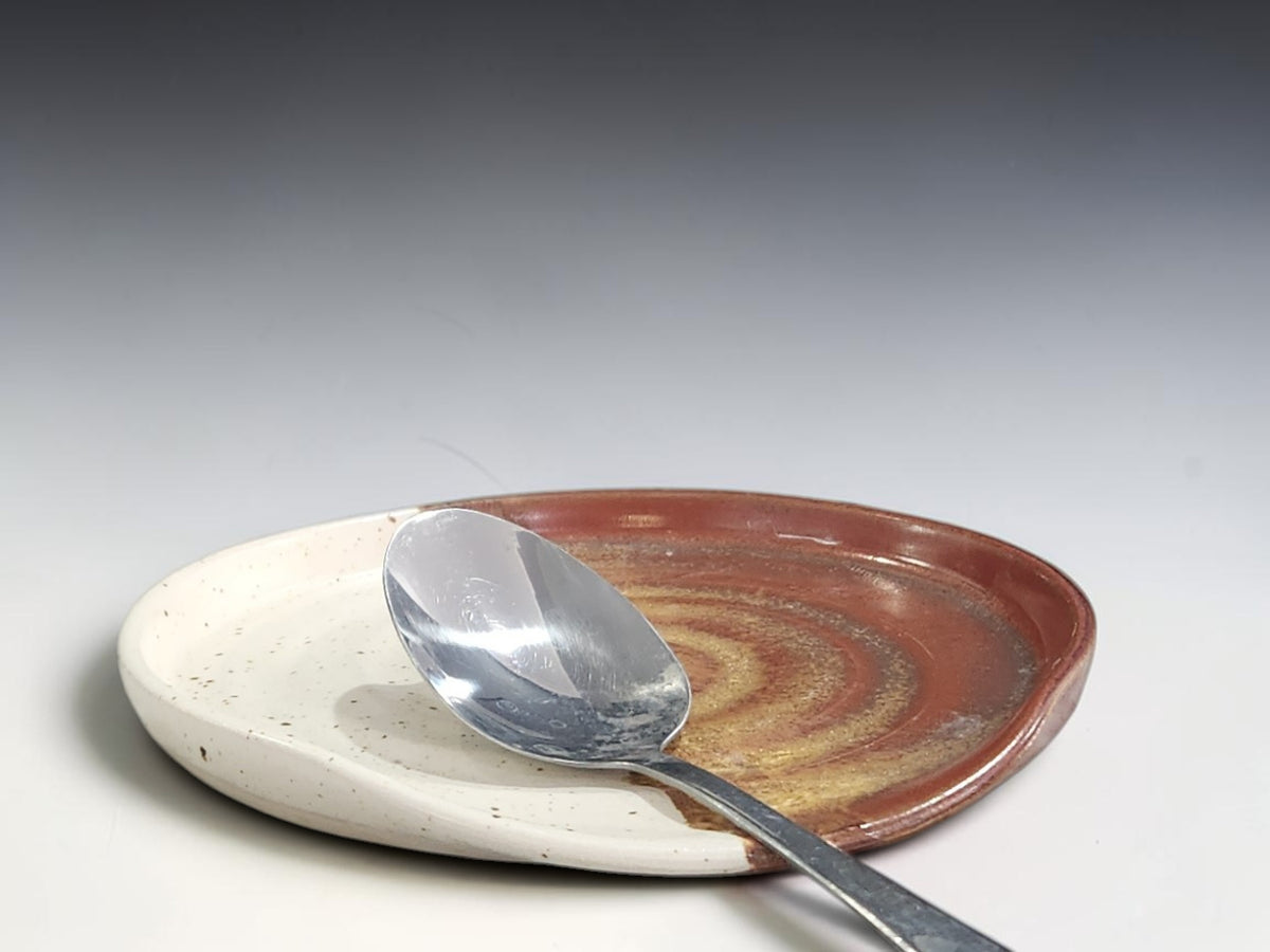 Handmade ceramic spoon rest measuring 16cm across and 1.5cm high