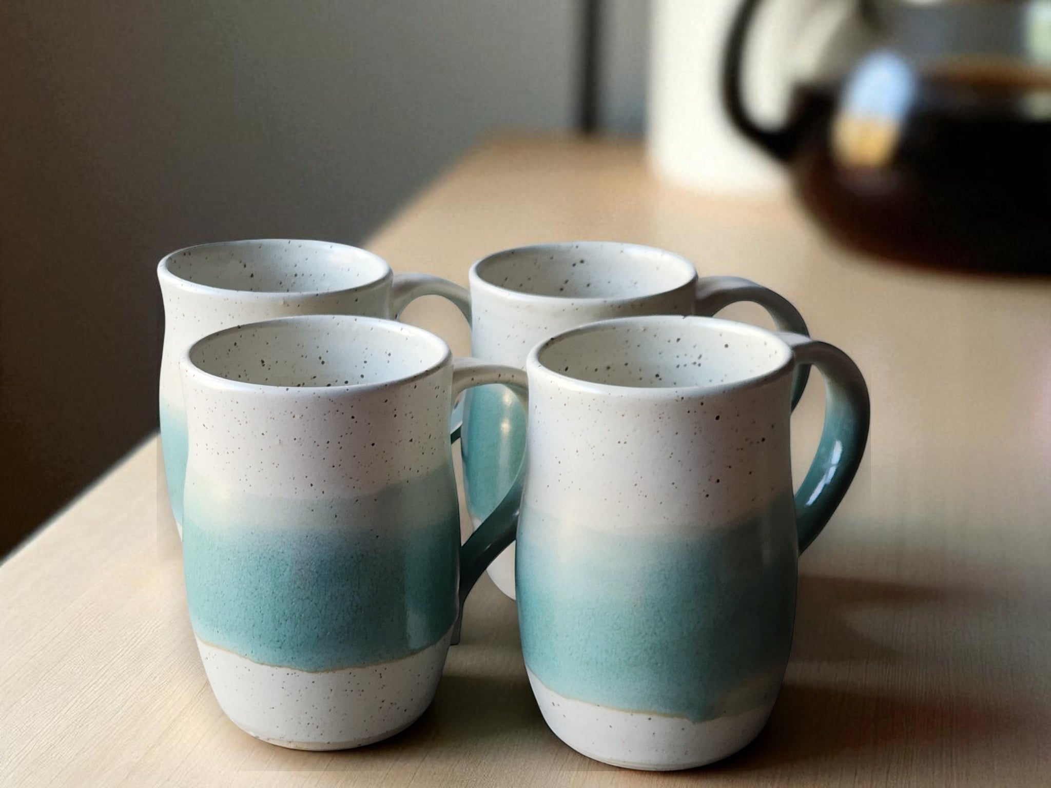 Wheel-thrown pottery mug green cream