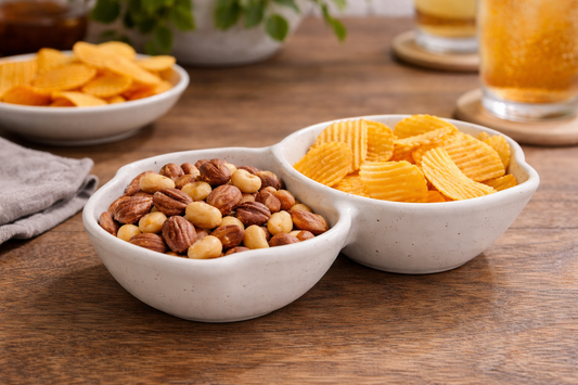 Handmade ceramic double snack bowl with nuts and chips