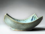 Unique wavy-edge ceramic bowl with glossy turquoise glaze and organic form