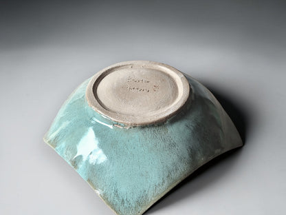 The underside of a Modern handcrafted pottery centerpiece bowl for dining or coffee table styling