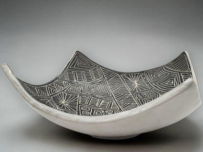 Contemporary ceramic centerpiece bowl with monochrome etched interior detailing