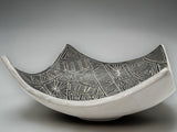 Contemporary ceramic centerpiece bowl with monochrome etched interior detailing