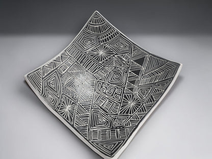 Modern ceramic serving bowl with textured black pattern and white outer finish