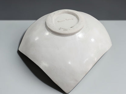 Under side of a Unique drape-style ceramic bowl with tribal-inspired etched pattern and organic shape