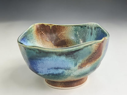 blue green ceramic bowl with earthy brown accents handmade pottery