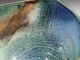 ceramic bowl glaze detail mottled blue green brown rustic pottery close up