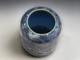 Artisan ceramic pot with mother-of-pearl iridescent finish