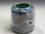 Decorative ceramic vessel with turquoise matte interior