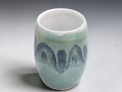 Front view of handmade Australian ceramic vase with glossy landscape-inspired glaze.