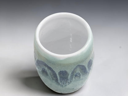 Top view of handmade stoneware vase with white glazed interior.