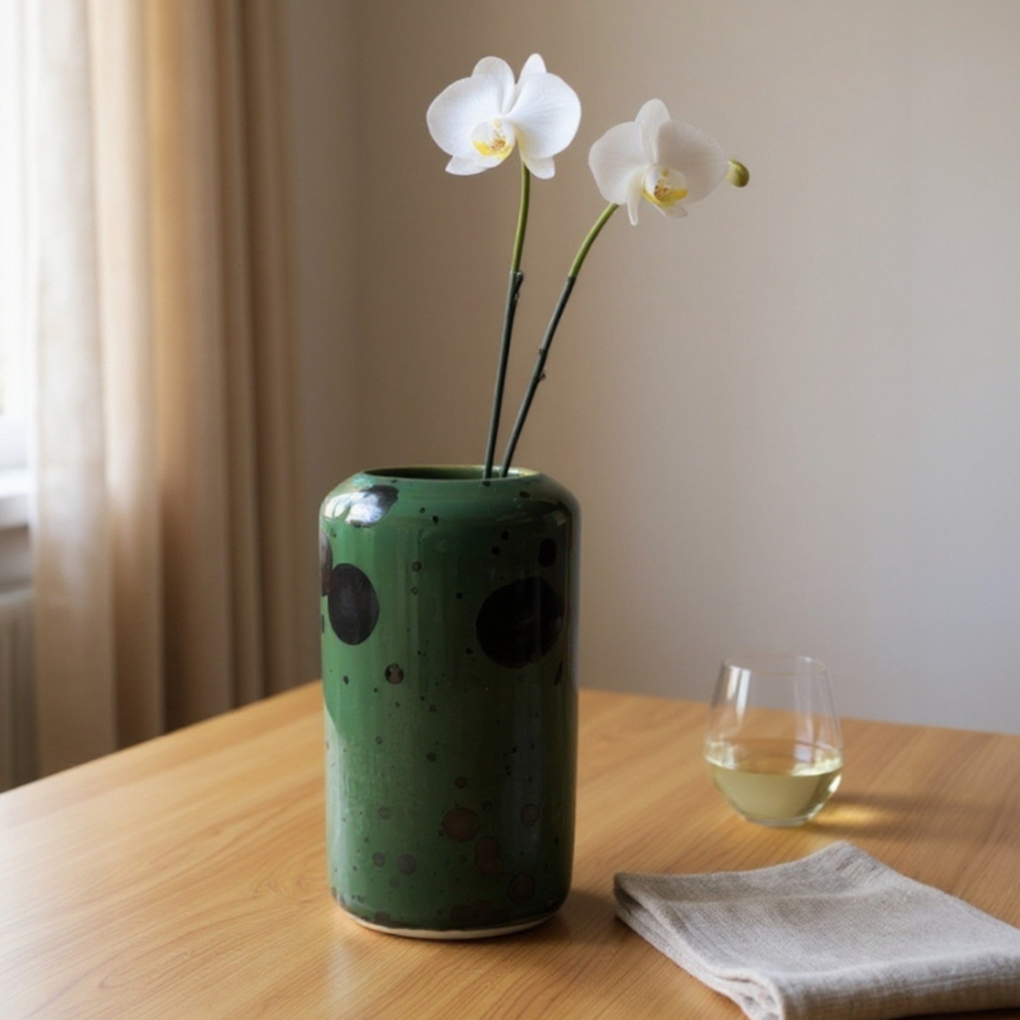 Handmade tall green crystalline pottery vase with metallic glaze