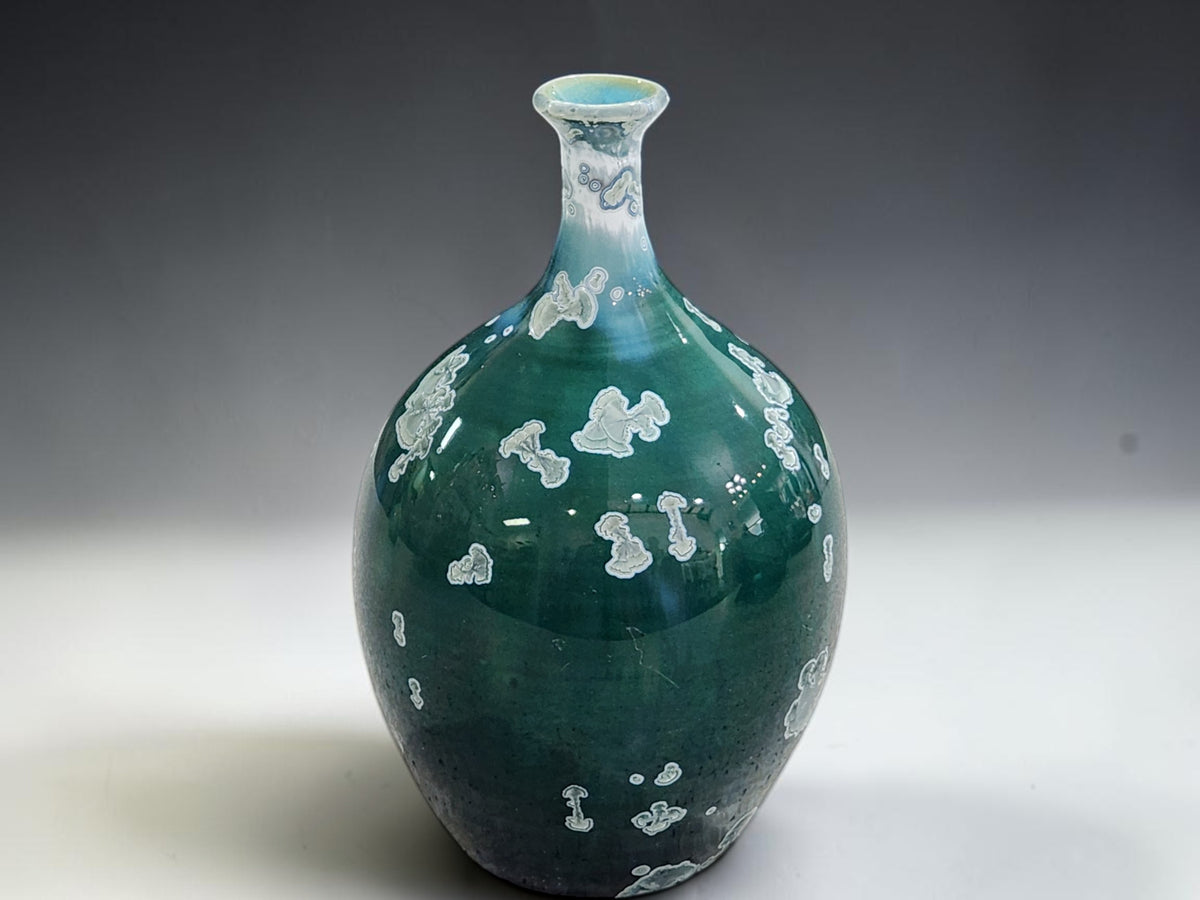Alternate view of the Buxton Pottery vase showing crystalline patterns around the ceramic body.