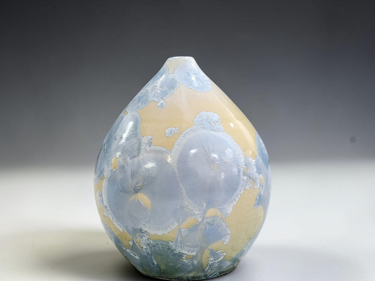 Alternate view of the small crystalline pot showing the changing glaze pattern around its body.