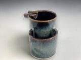 Handmade ashtray in sculptural double form with glossy dark rim and blue glaze