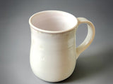 Handmade pottery coffee mug in soft ivory white glaze