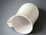 Elegant ivory ceramic mug with subtle crystalline patterns