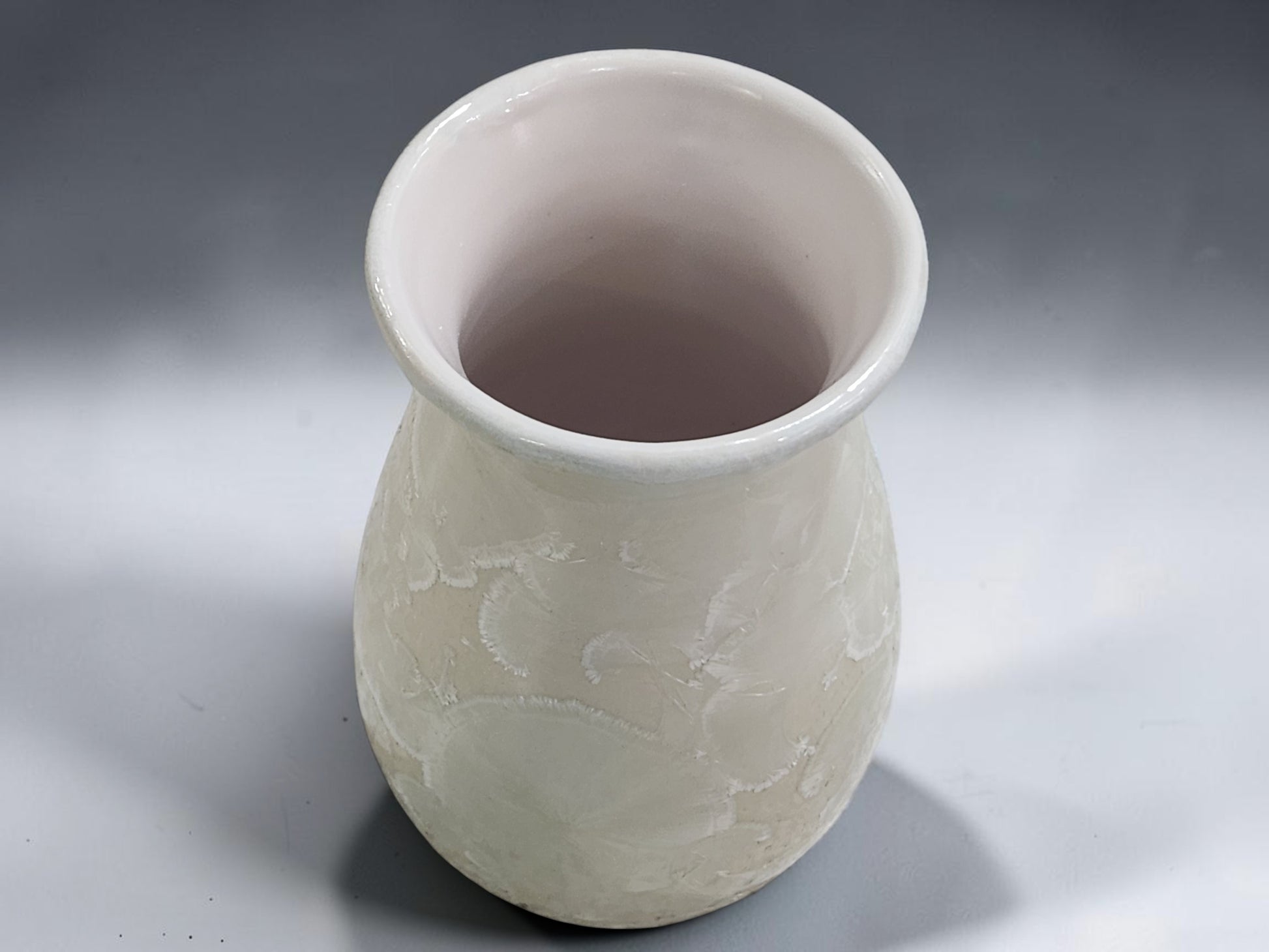 Wheel-thrown porcelain flower vase measuring 15 cm tall