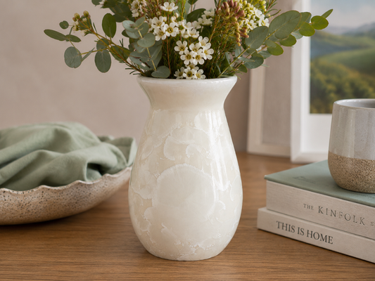 White crystalline porcelain vase with flowers in a warm lifestyle setting