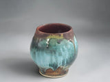 Handmade ceramic tea cup with earthy turquoise and brown glaze from the Bush Creek Earth Collection